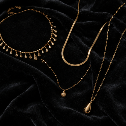 Aurelia Cascade Necklace flat lay on dark velvet